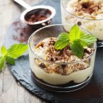 Sweet homemade dessert with cream and chocolate, selective focus