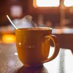 hot-drink-in-an-orange-mug-with-spoon-2026-09-22-21-48-59-utc